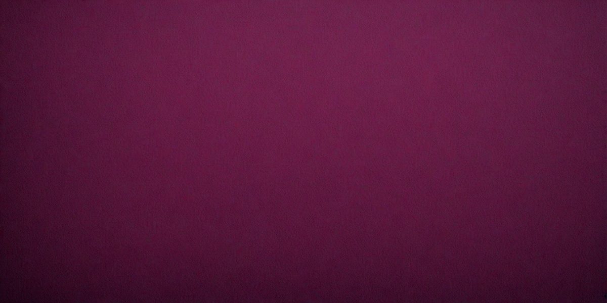 The primary subject of the image is a large, purple wall. The setting is a room with a purple background, and the visual style is a close-up of the wall. The dominant colors in the image are purple, and the overall atmosphere is calm and serene.